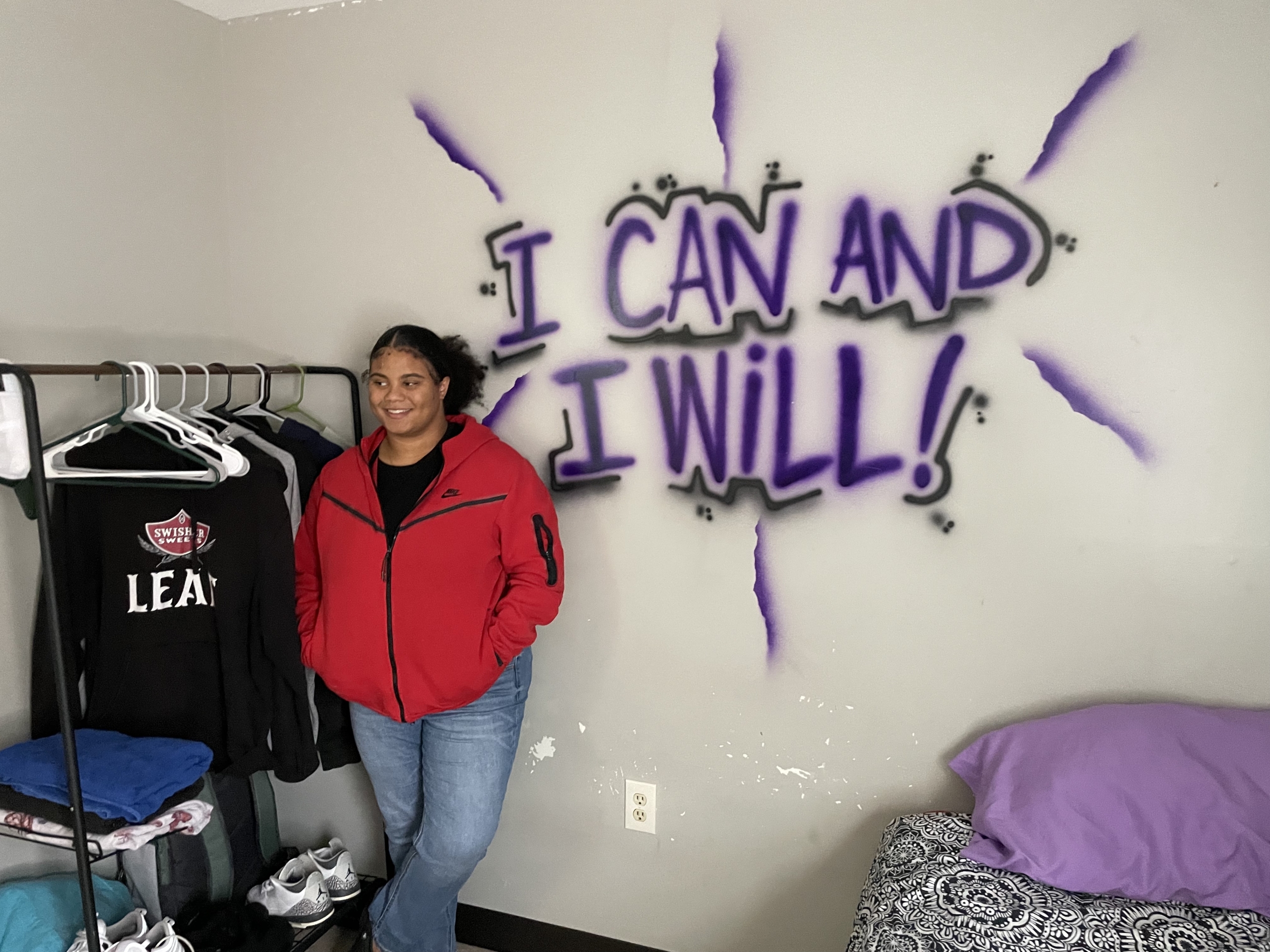 Alexis Pope, 18, a resident at Forget Me Knot, a group home in North Philadelphia, stand in her room. | Photo By Yvonne Latty